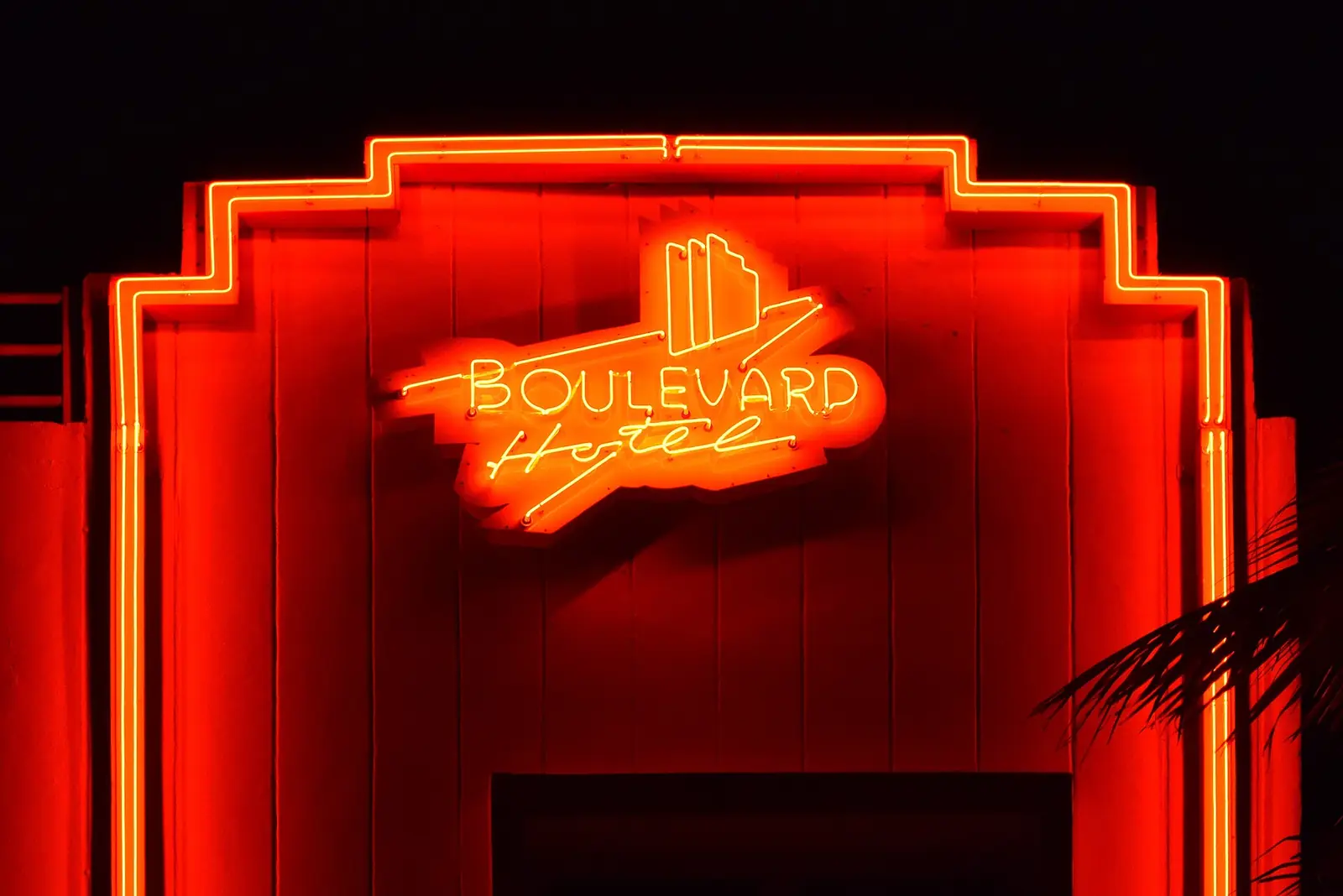 The red and orange neon sign of the Boulevard Hotel in Miami Beach at night